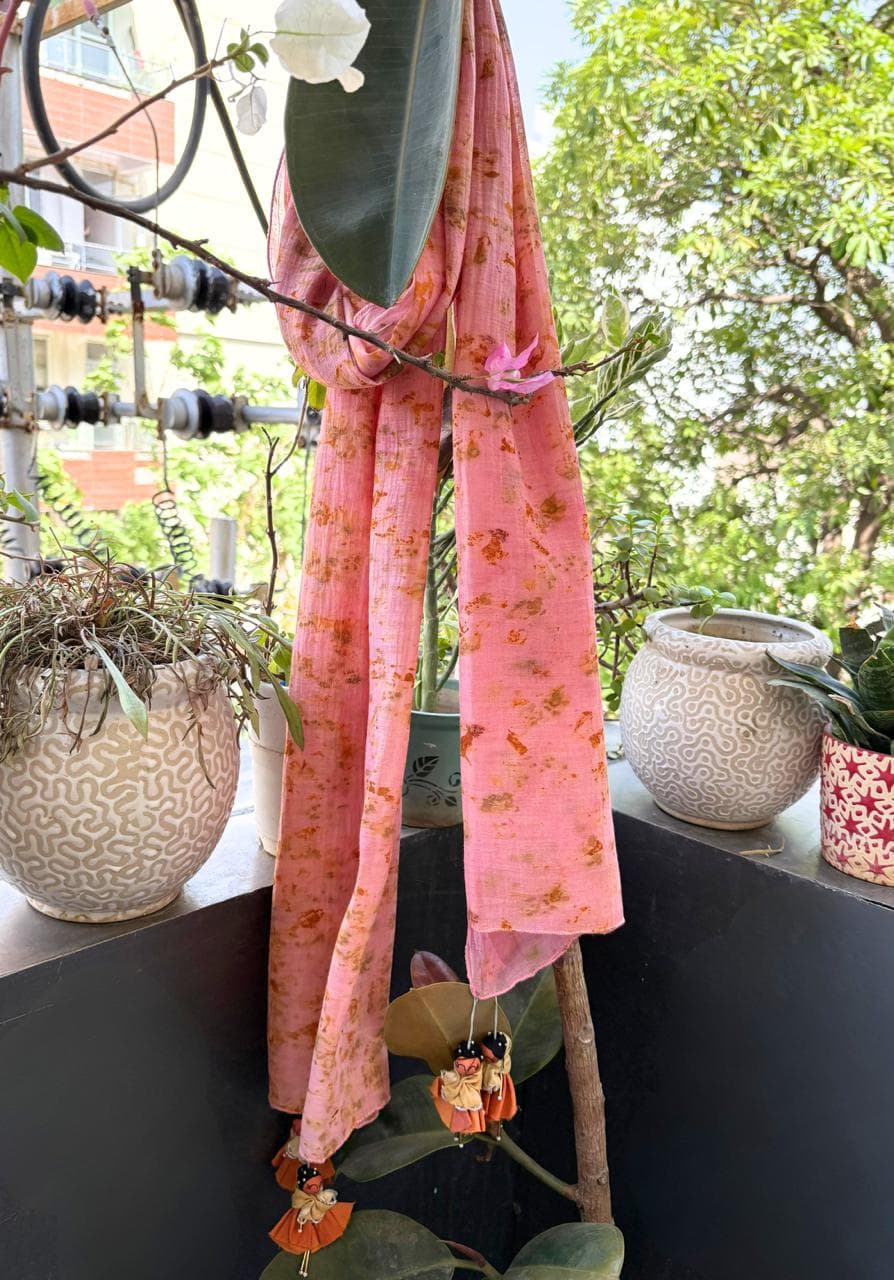 Shakuntala scarf in baby pink sappanwood dye with marigold bundle dye on mul cotton, finished with orange Shakuntala doll tassels - SewMuchBetter